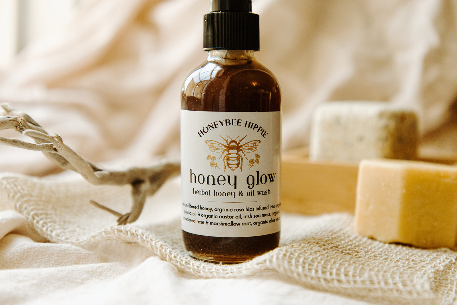 a single bottle of honeybee hippie's herbal honey and oil facial cleansing wash made with organic natural ingredients for washing irritated and acne prone skin