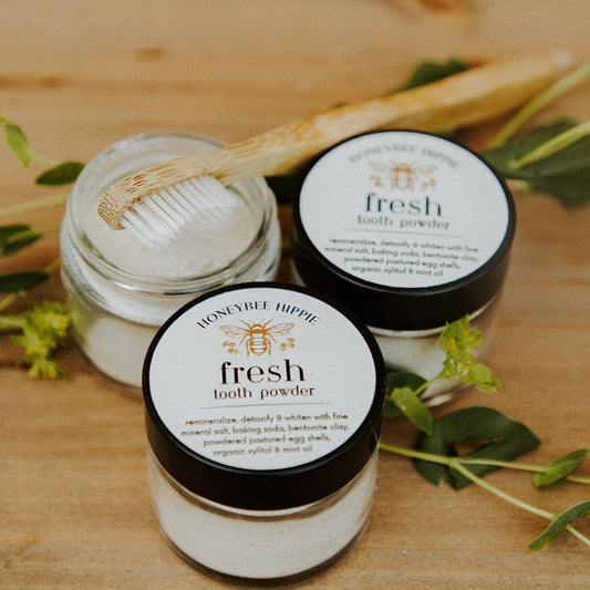 open and sealed jars of tooth powder made from all natural ingredients to clean teeth