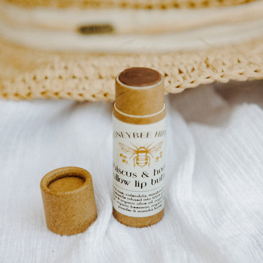 a tube of all natural and organic tallow lip balm crafted to moisturize and protect lips with tallow and oils by honeybee hippie