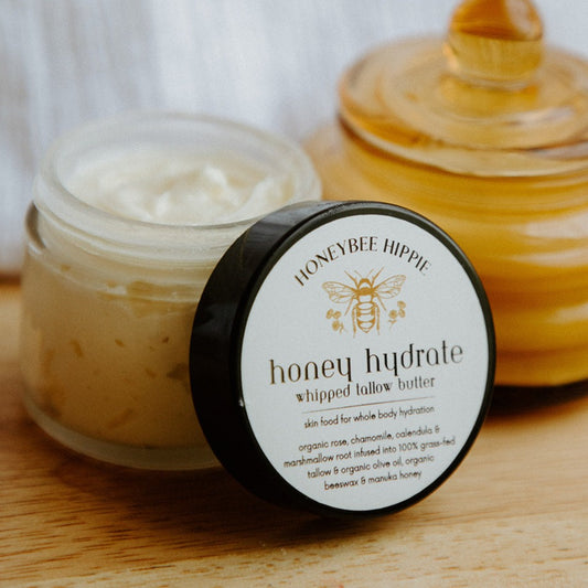 an open jar of honeybee hippie's best selling honey tallow whip for moisturizing and soothing skin with natural ingredients and manuka honey