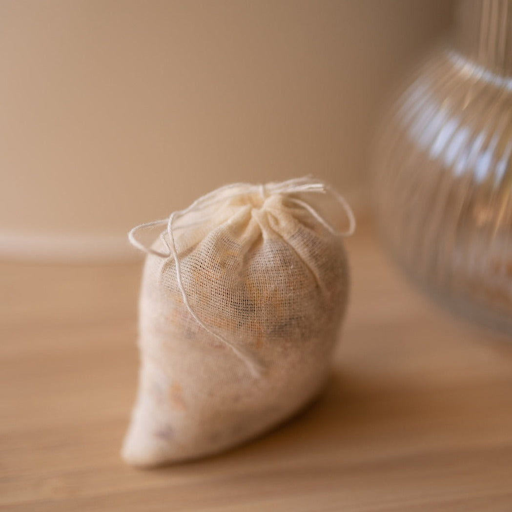 a bag of herbal bath salts handmade by honeybee hippie to bring relaxation to your skin and mind
